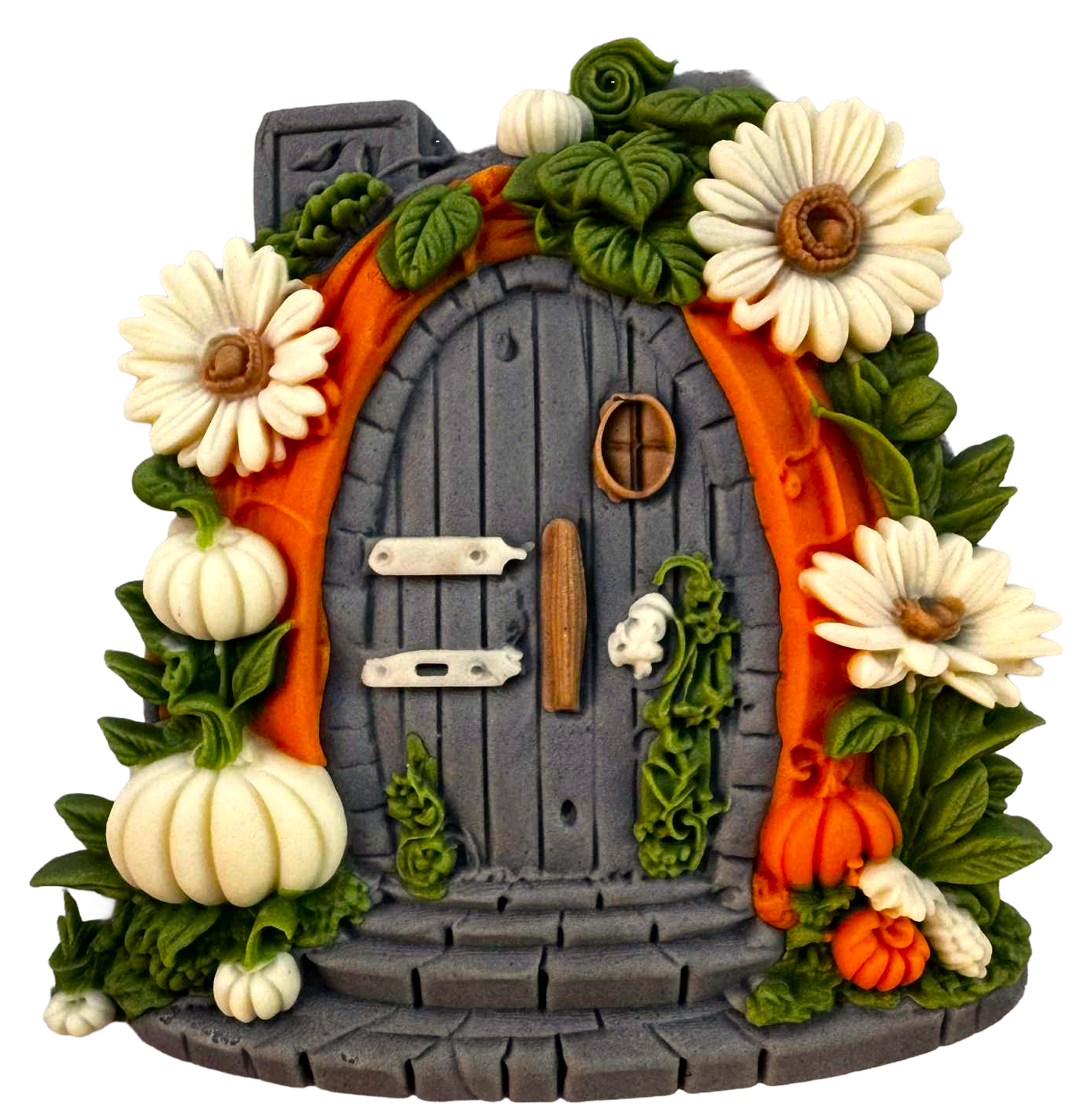 Decorative fairy door with autumn elements on a white background